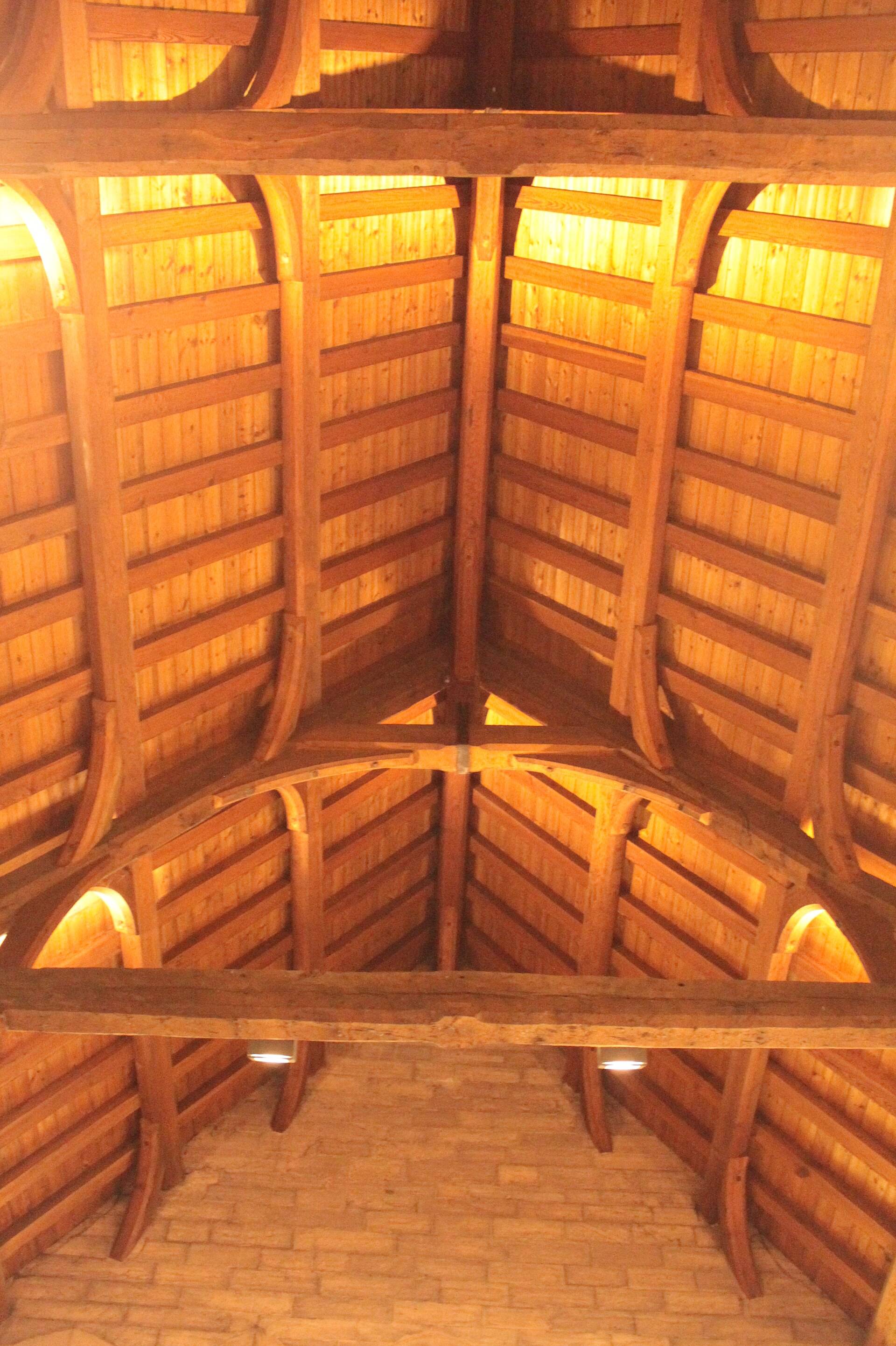 A timber roof of rafters, purlins and braces seen from below