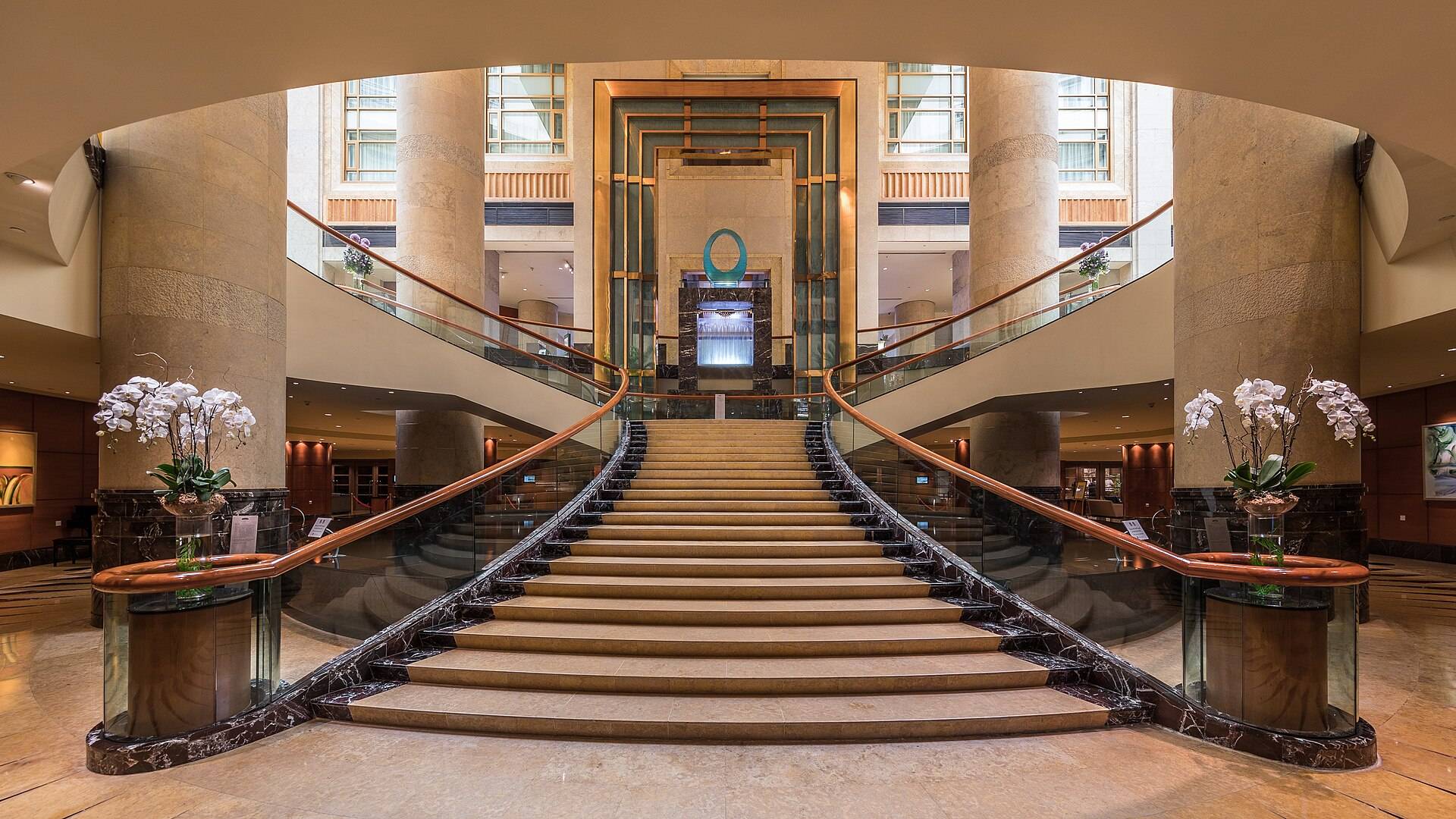 Sample last frame of a lobby turntable: a hotel lobby with a double staircase
