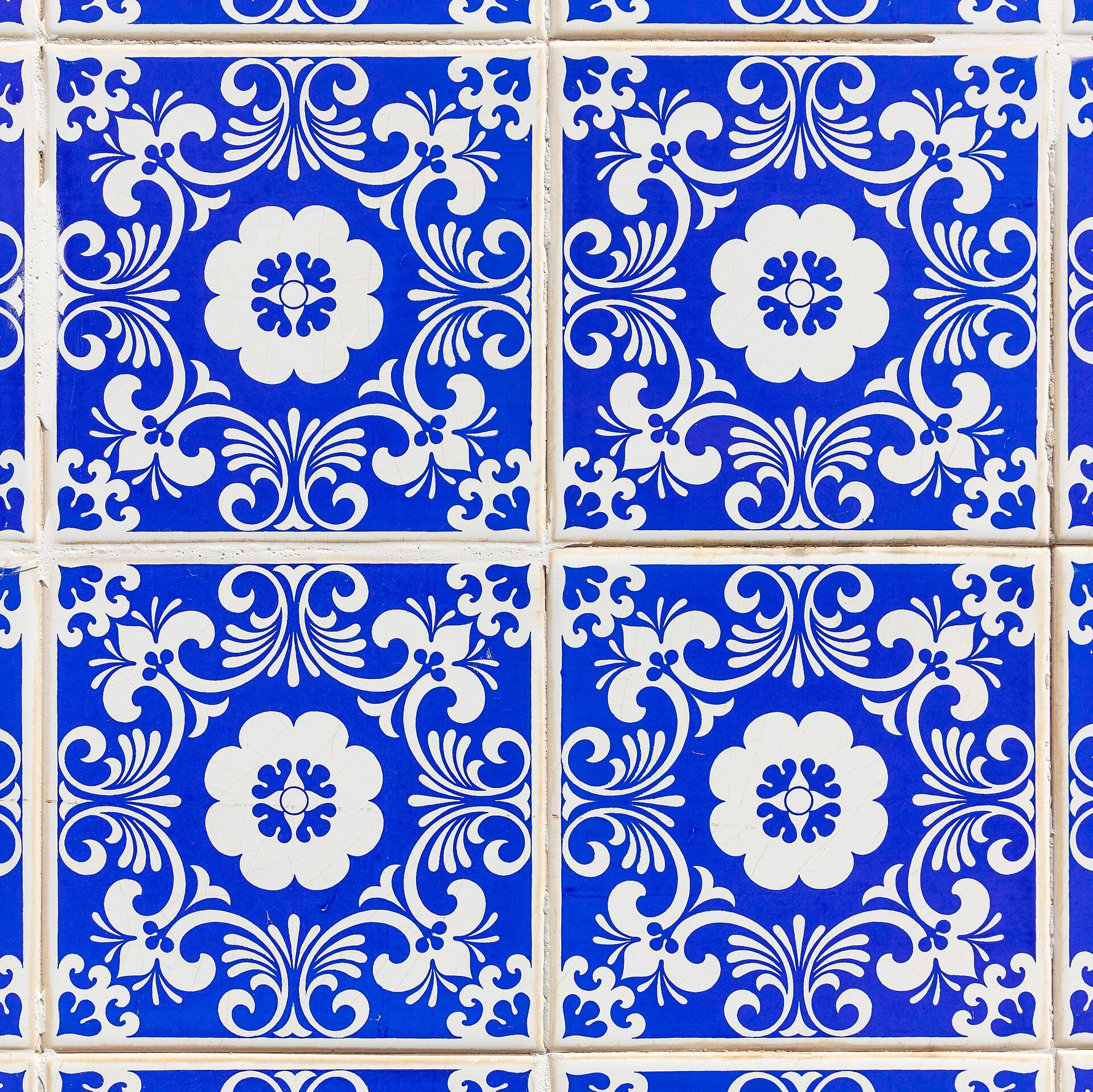 Blue and white glazed tiles with a repeating floral pattern